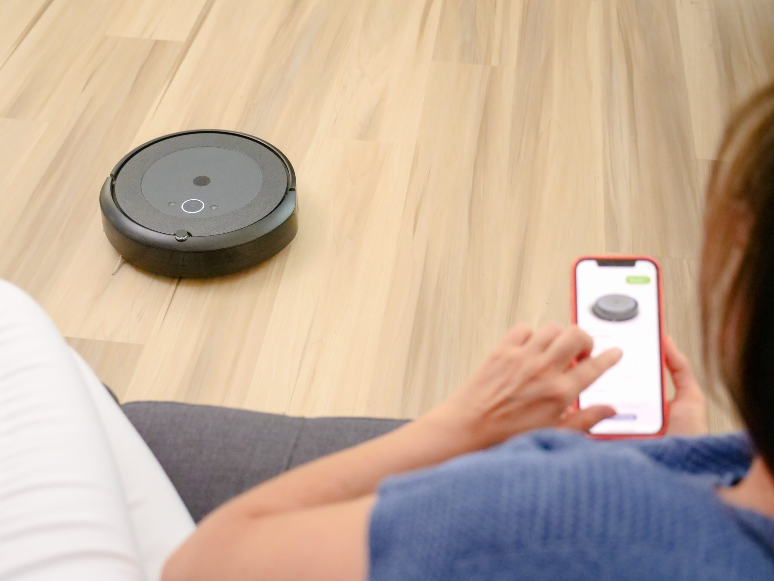 woman operating vacuum cleaner