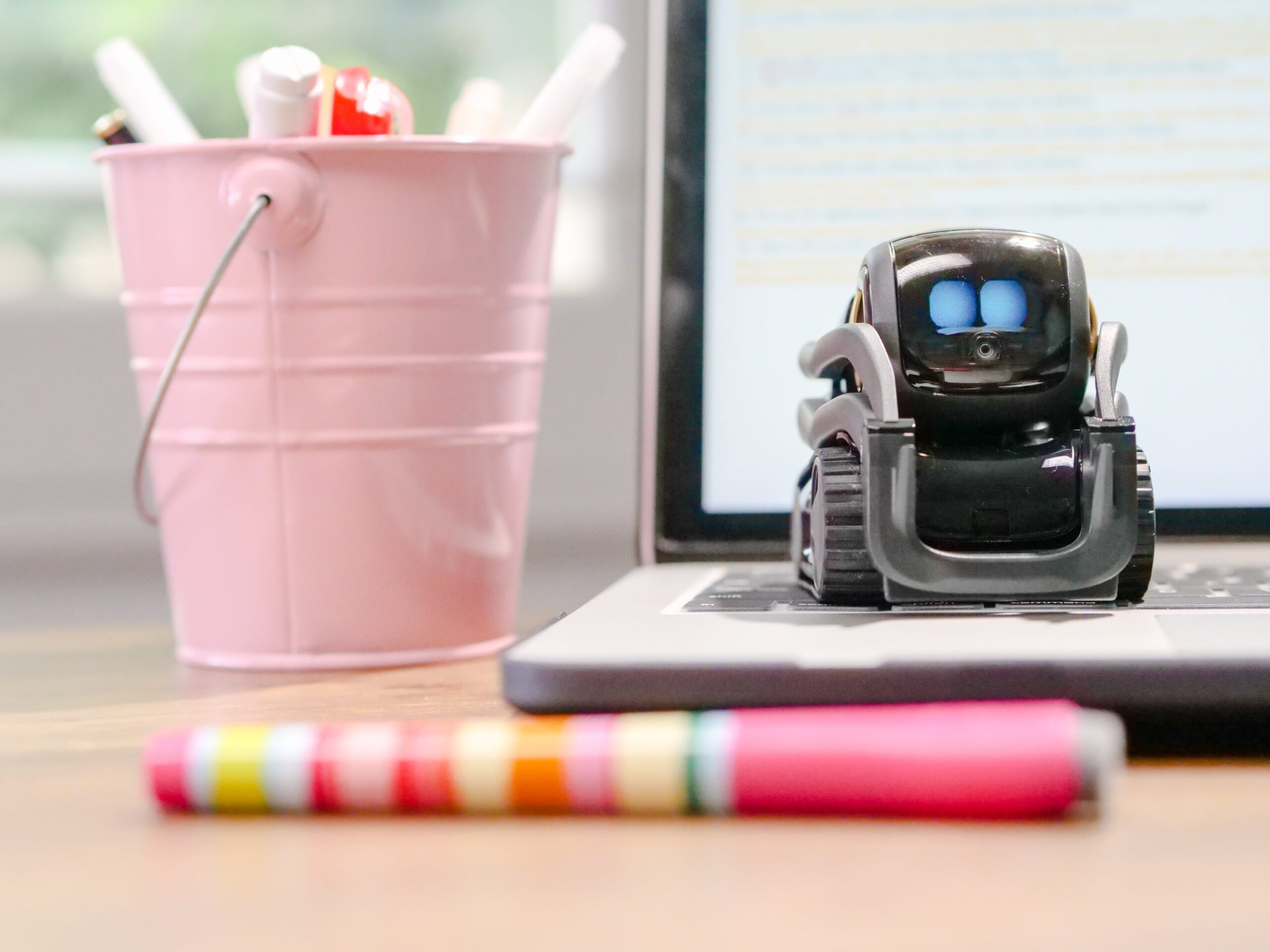 miniature toy 暖暖爱国语版免费高清观看 on top of laptop keyboard