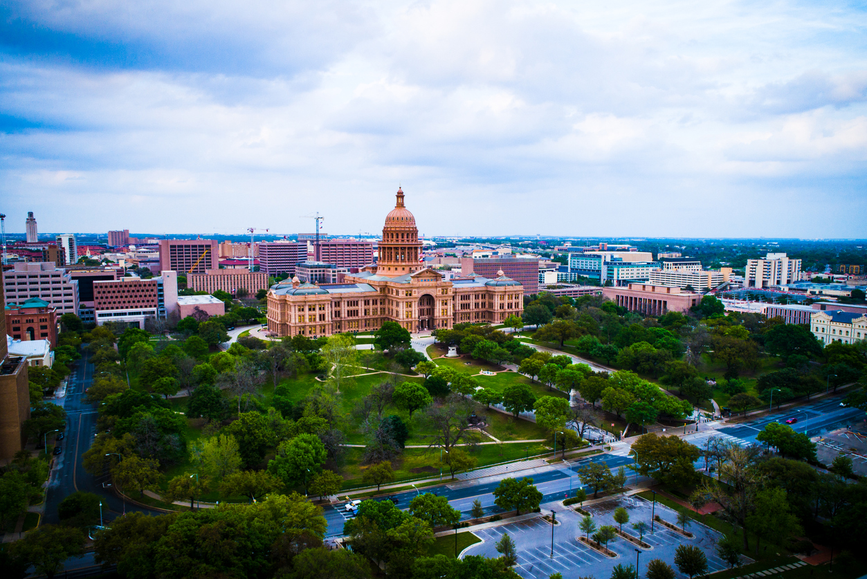 Golden hour sunset over the Austin landscape at the Texas State Capitol building